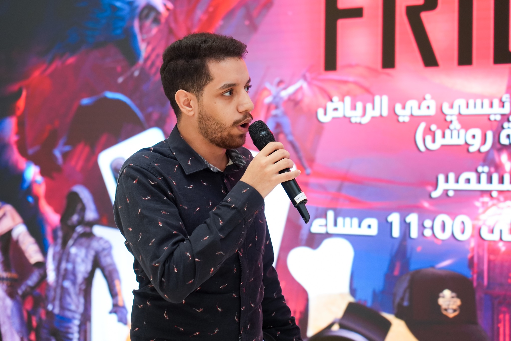 AbdulRahman presenting at a gaming event